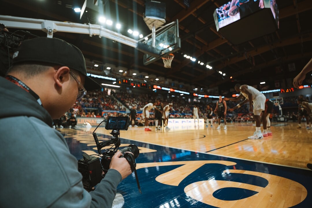 Student practicing camera operation with a broadcast camera