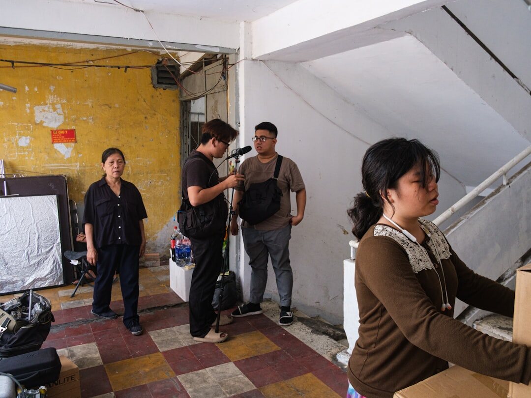 Production team collaborating around a control room desk