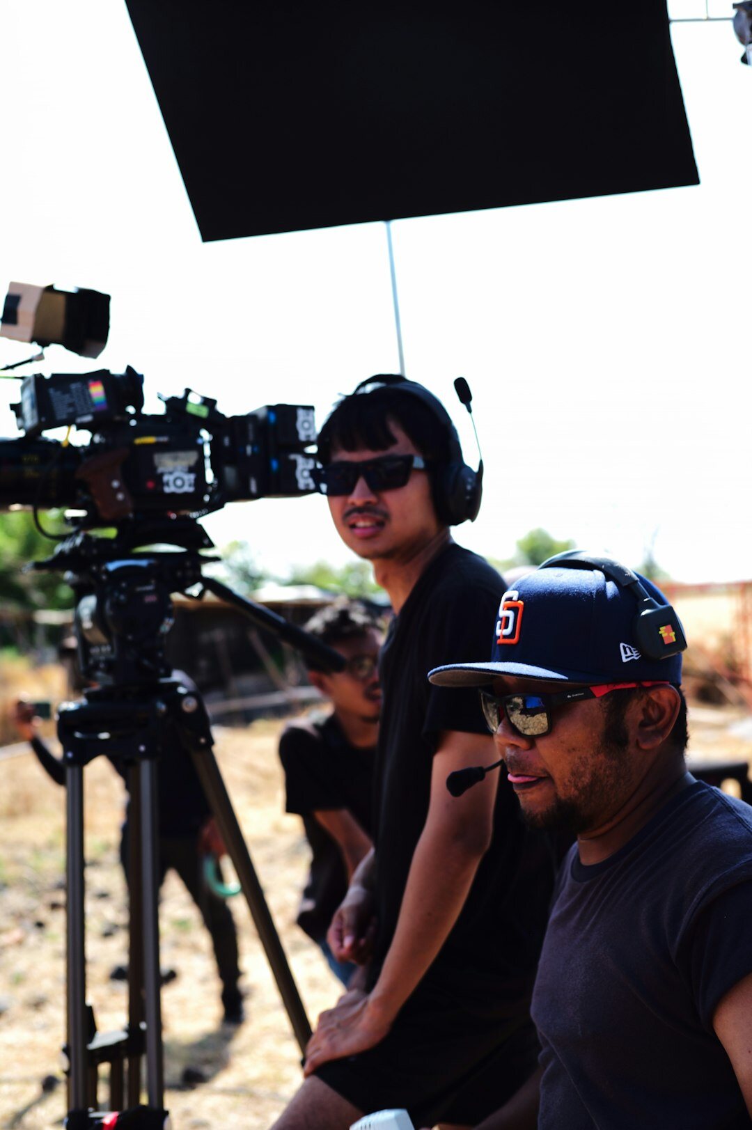 Director giving instructions to a production team in a control room