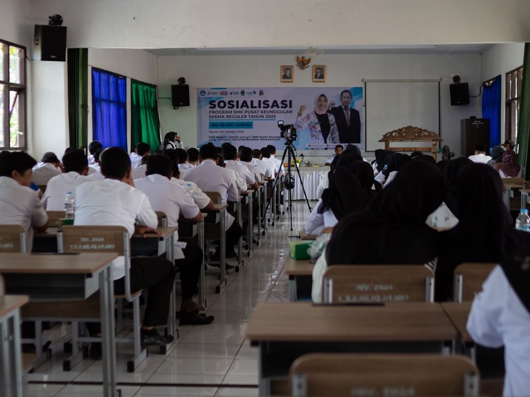 Students learning broadcast production in a training classroom